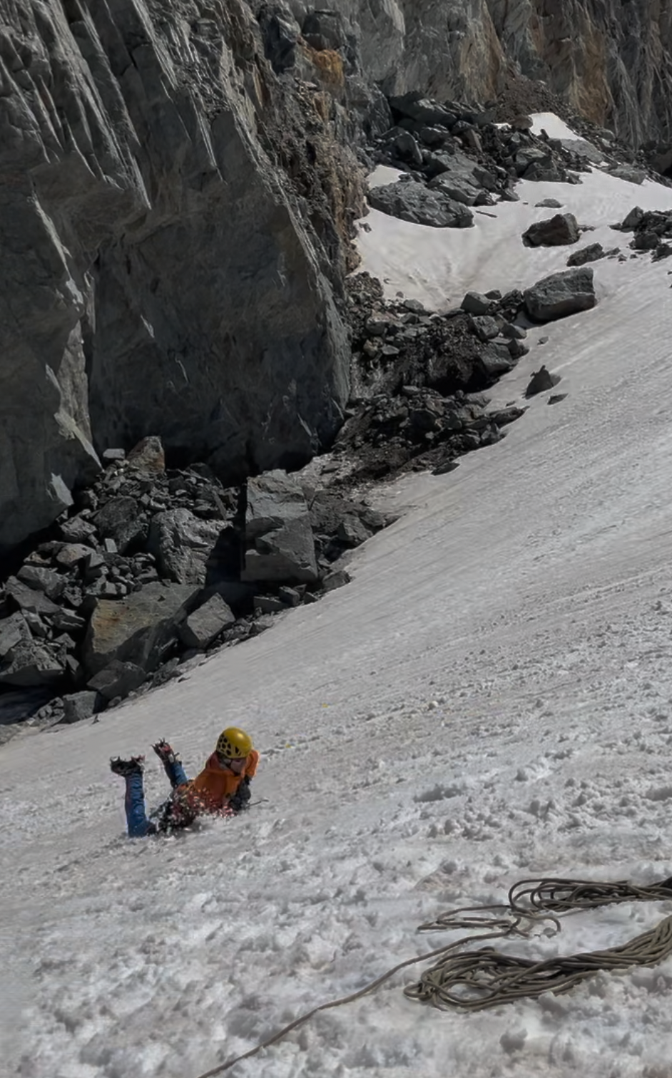 A person lying on a snowy slopeAI-generated content may be incorrect.