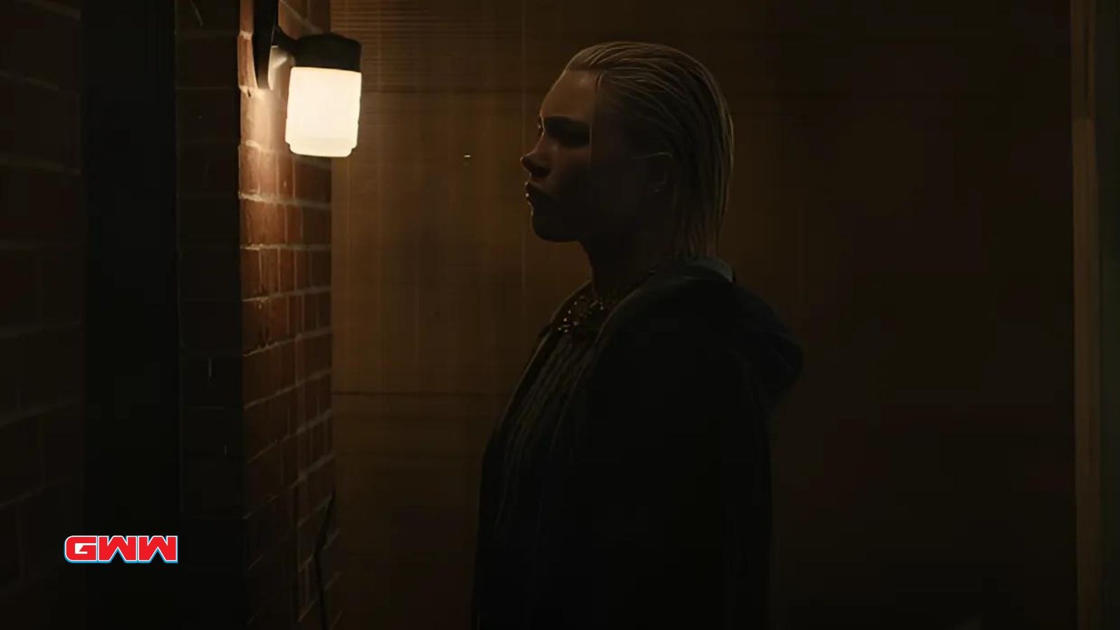 Florence Pugh as Yelena Belova standing in front of a brick wall in Thunderbolts