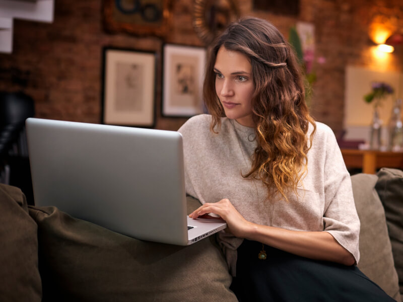 Woman looking at her laptop