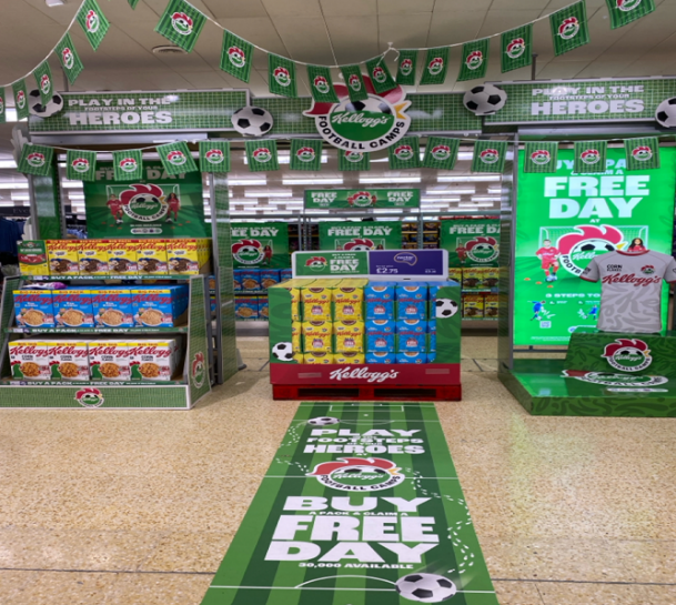 A store with a green carpet and football balls

Description automatically generated with medium confidence