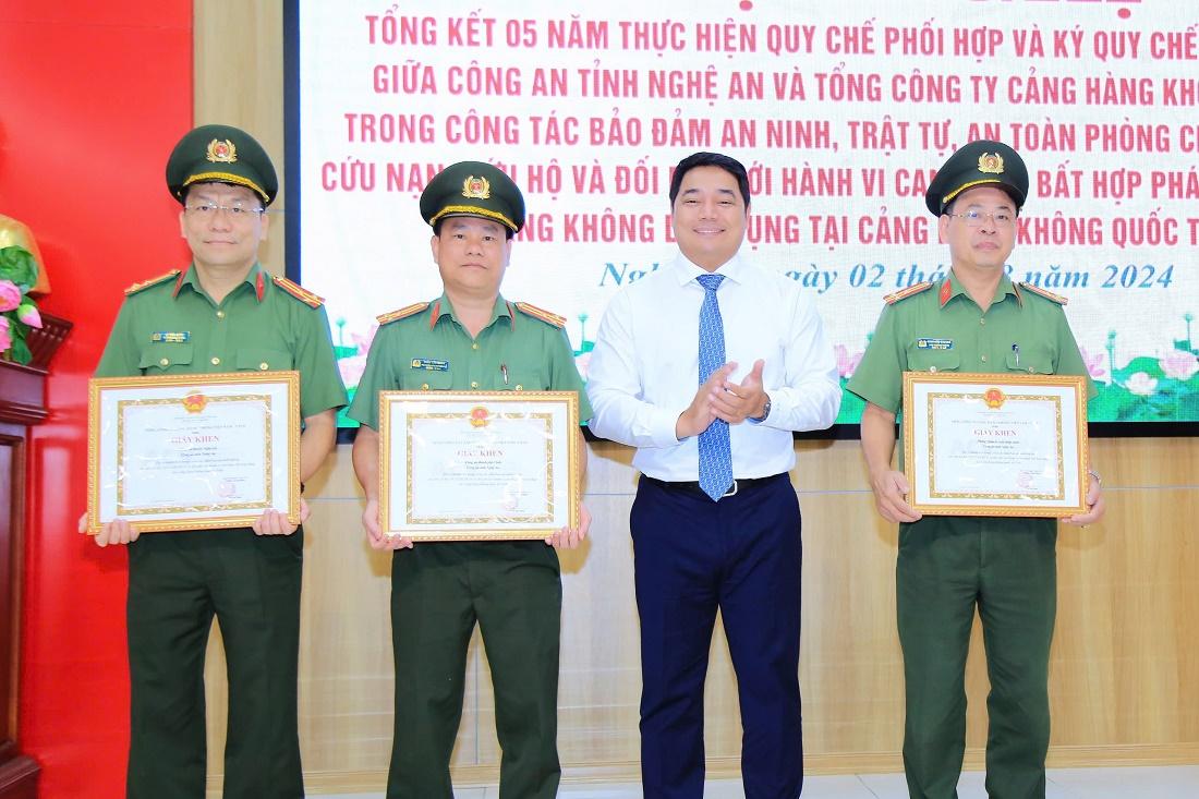 A group of men in uniform holding certificatesDescription automatically generated