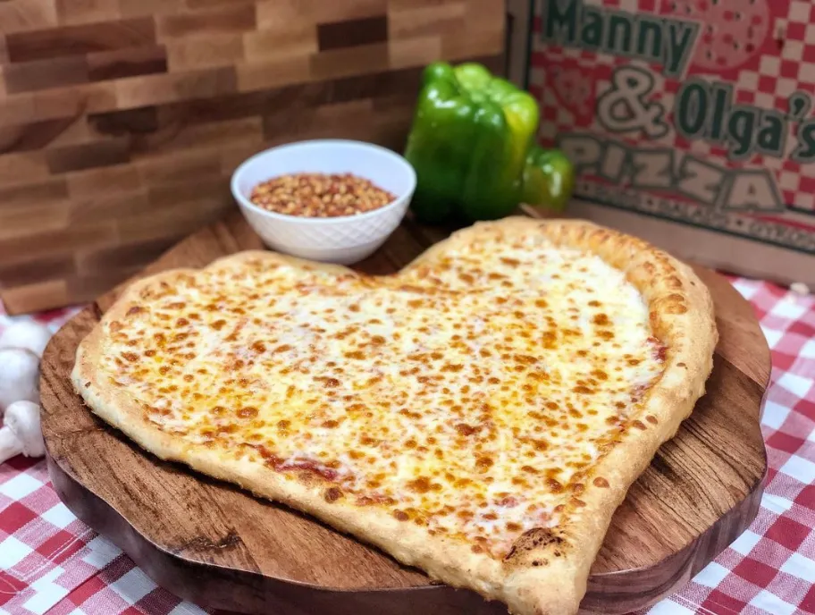 manny and olgas pizza made with mozzarella cheese givinzg it the perfect taste