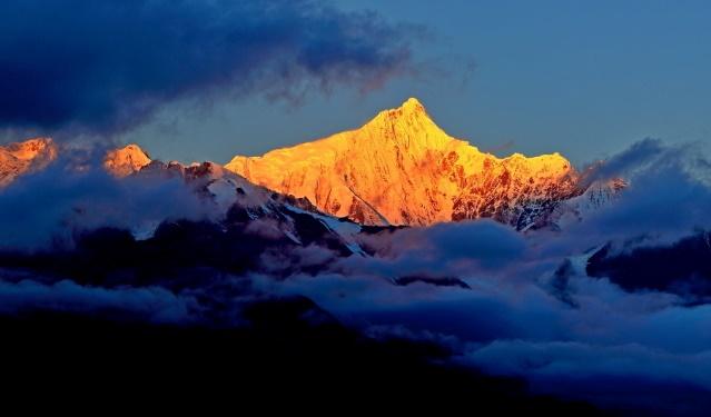 A mountain range with clouds