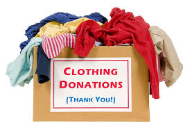 image of a cardboard box overfull of clothing and text of Clothing donations, thank you