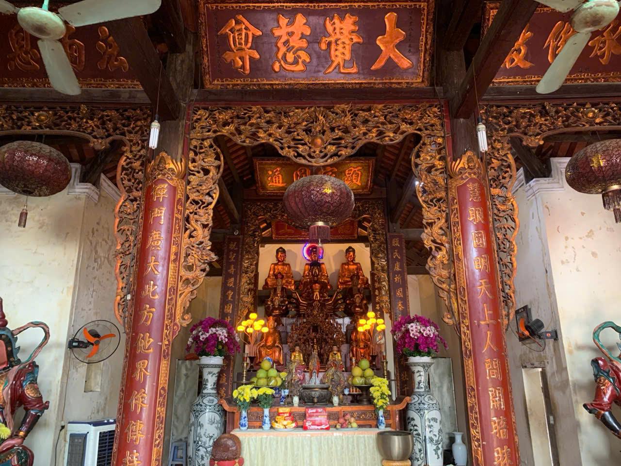 A shrine with a group of statuesDescription automatically generated with medium confidence