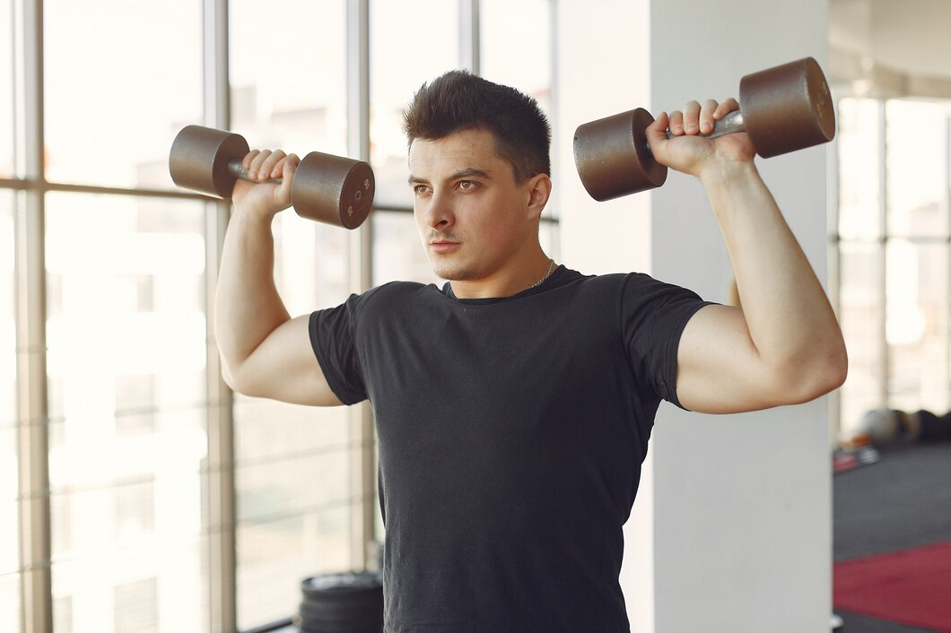 Person holding dumbbells ready for a full body workout at home