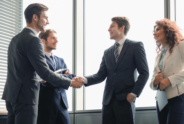 Premium Photo | Business people shaking hands finishing up a meeting