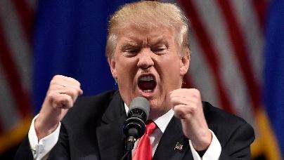 A person in a suit and tie with his mouth open and fists in the air

AI-generated content may be incorrect.