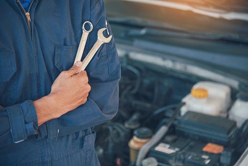 A mechanic holding two wrenches in his pocket
AI-generated content may be incorrect.