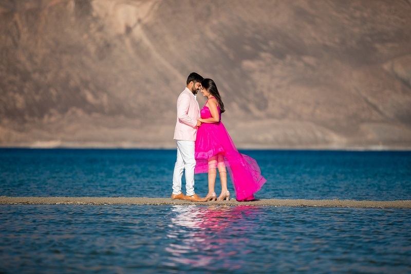 Romantic couple pose at Pangong Lake, one of India’s best pre-wedding locations