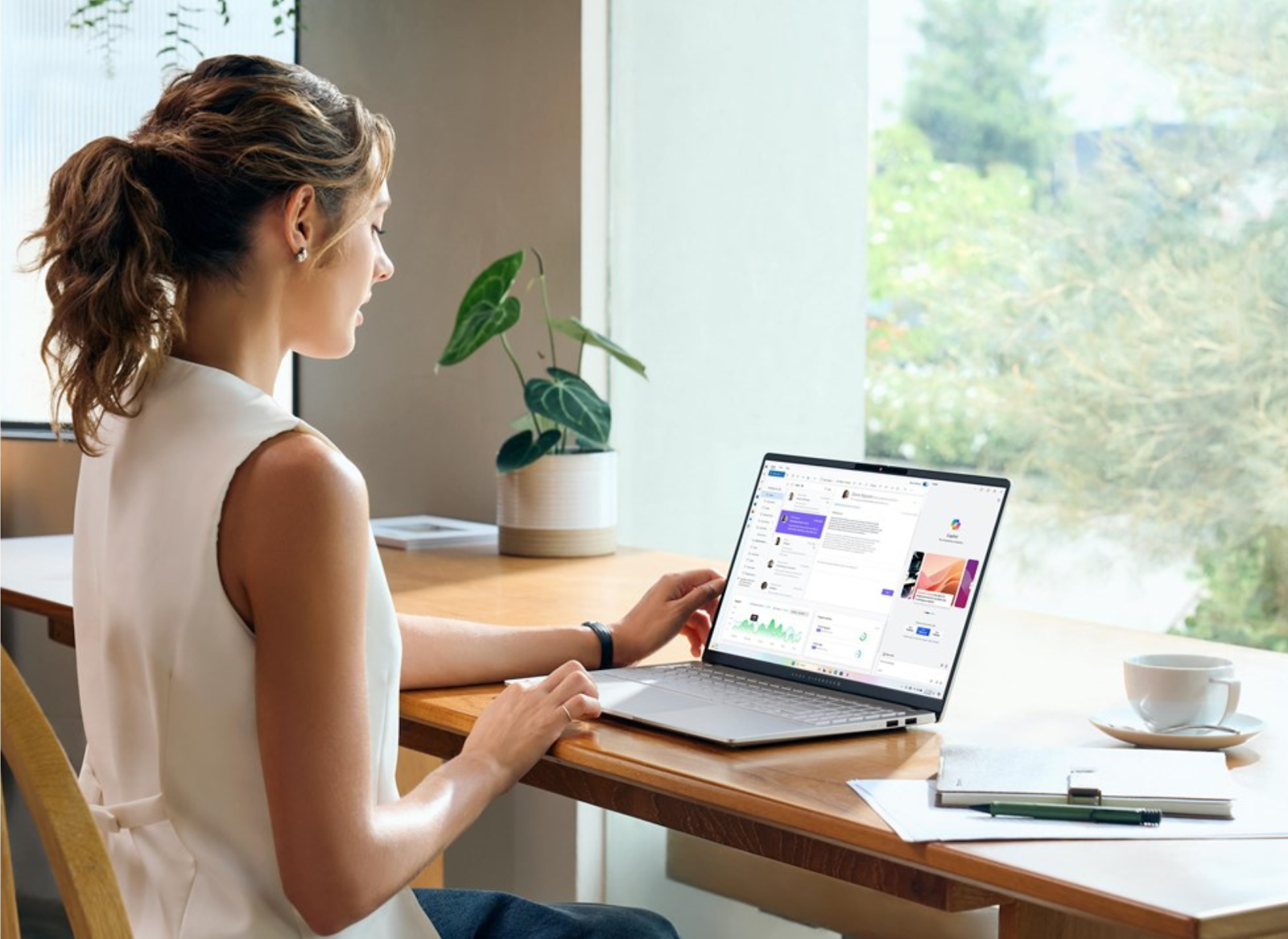 A person sitting at a desk using a computer

AI-generated content may be incorrect.
