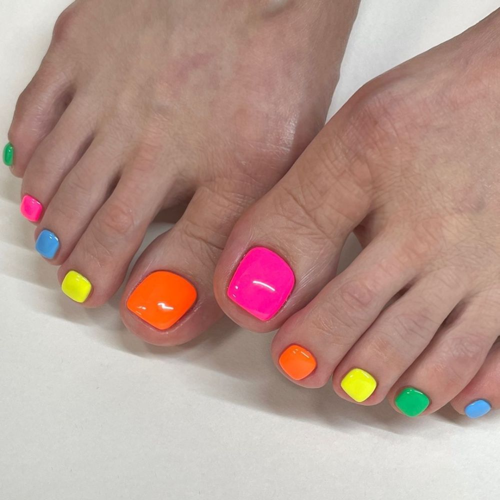 Close up of foot with radiant toe nail having Colorful Toe Nails