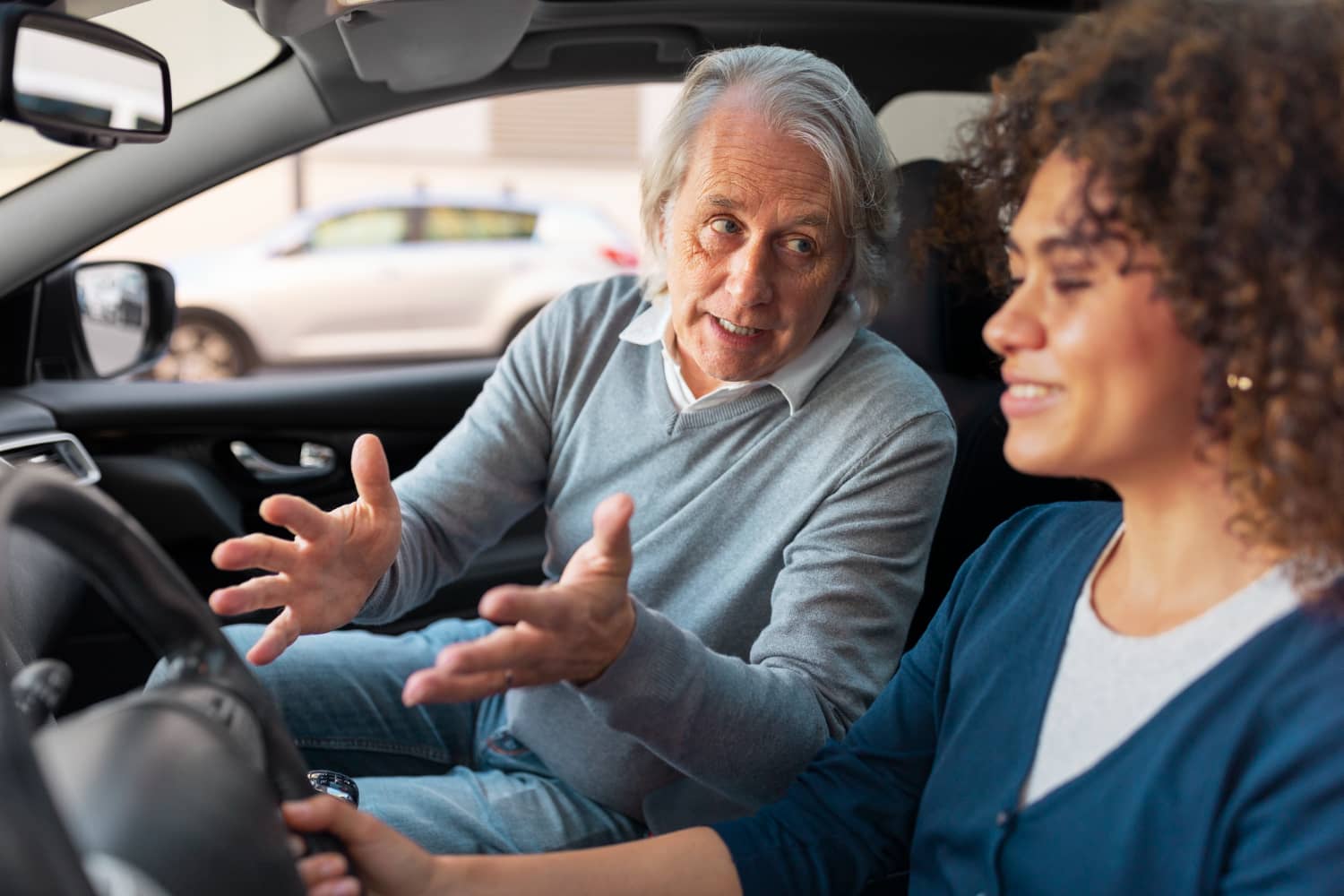 a woman taking a driving license lesson in belgium