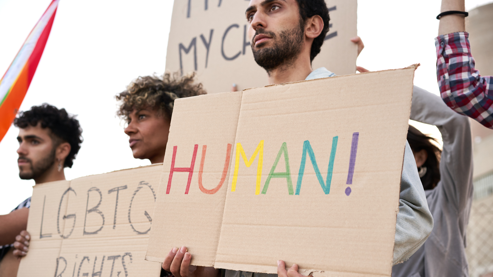 (people protesting against LGBTQ+ discrimination)