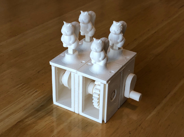 3D printed modular automata base with gear mechanisms, designed for customization with various automata figures.