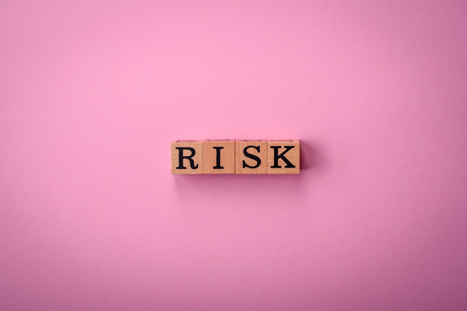 Word “risk” on wooden blocks. 