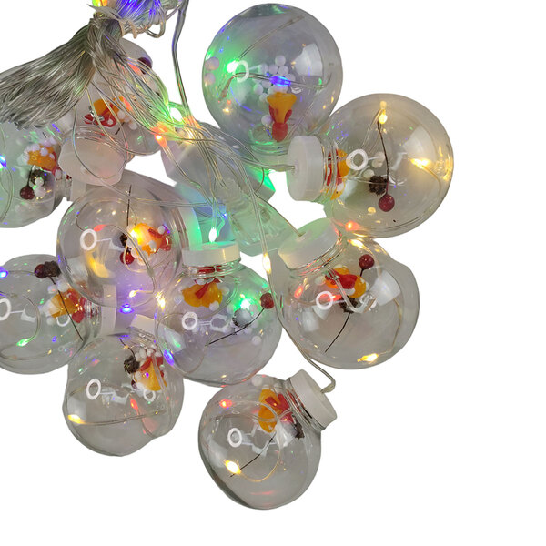 Esferas transparentes decoradas e iluminadas com LEDs coloridos.