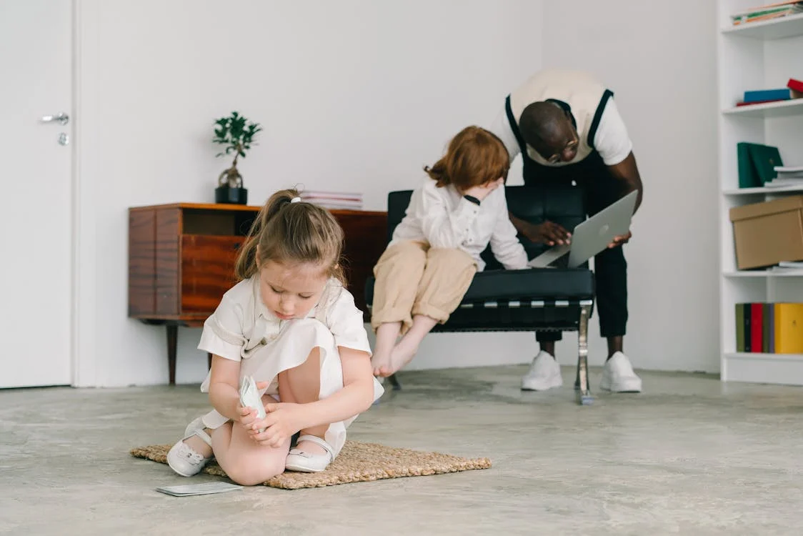 Girl Playing with Cards while Sitting on a Rug