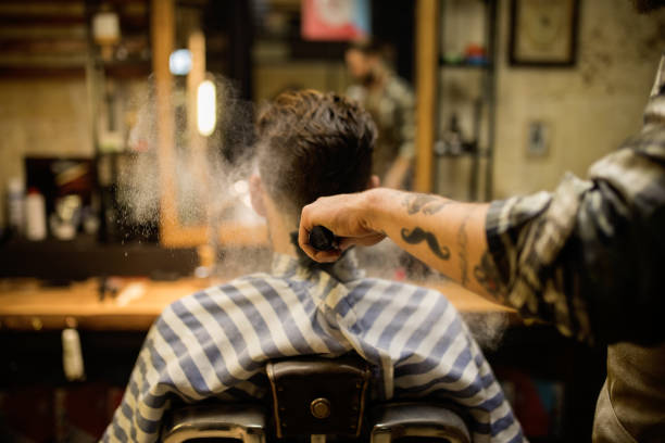 A client receiving a trim at a barbershop to keep their haircut sharp and well-groomed.