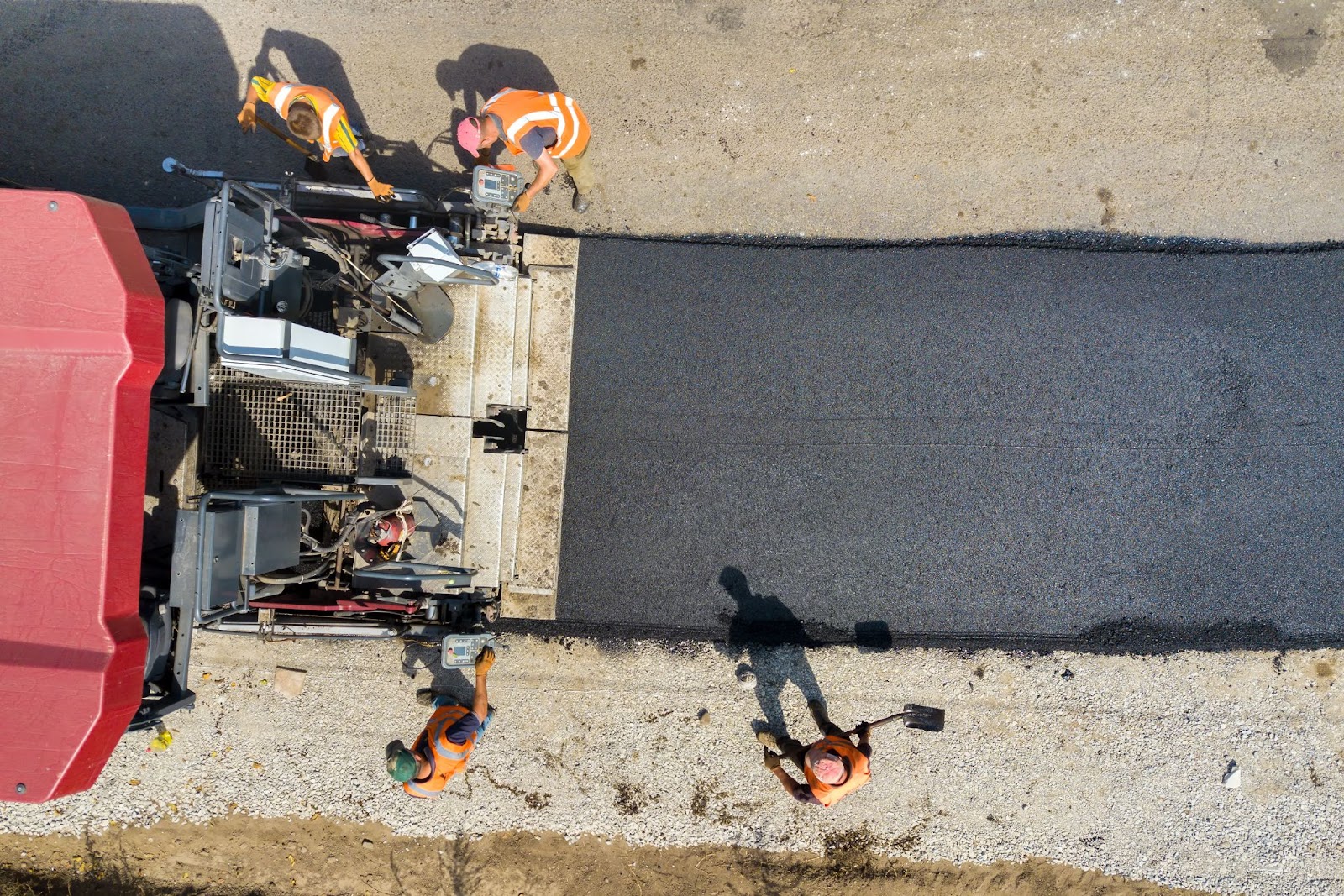 Construction workers paving concrete. 