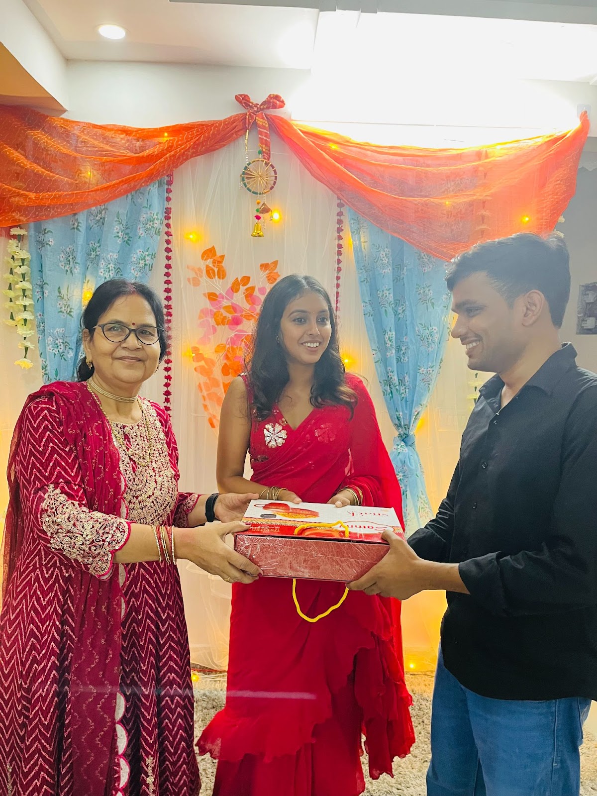 Getting awards at Probey Services by an employee of Probey Services who wins the contest at the Diwali event.