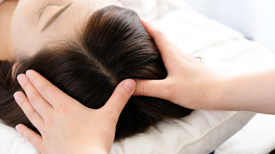 Woman getting a scalp massage