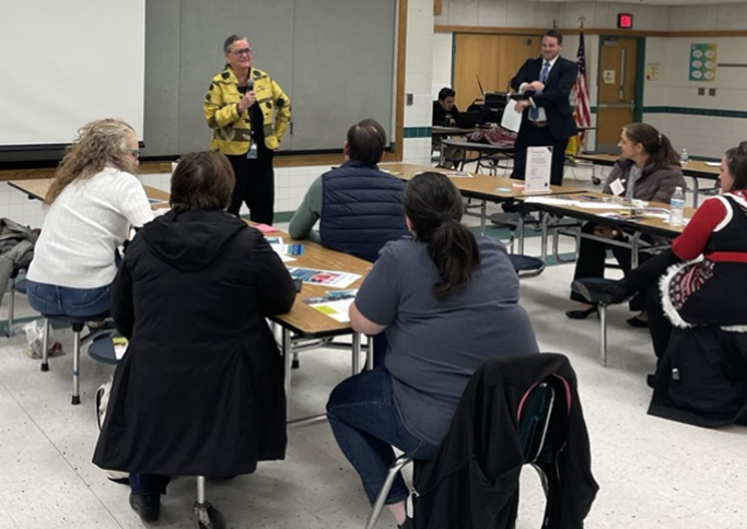 Dr. Reid speaking in front of a group of parents at the Family Vision Group meeting for Quad 3. 