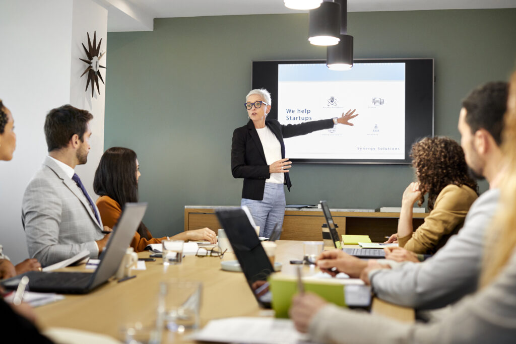 A professional giving a sales pitch presentation
