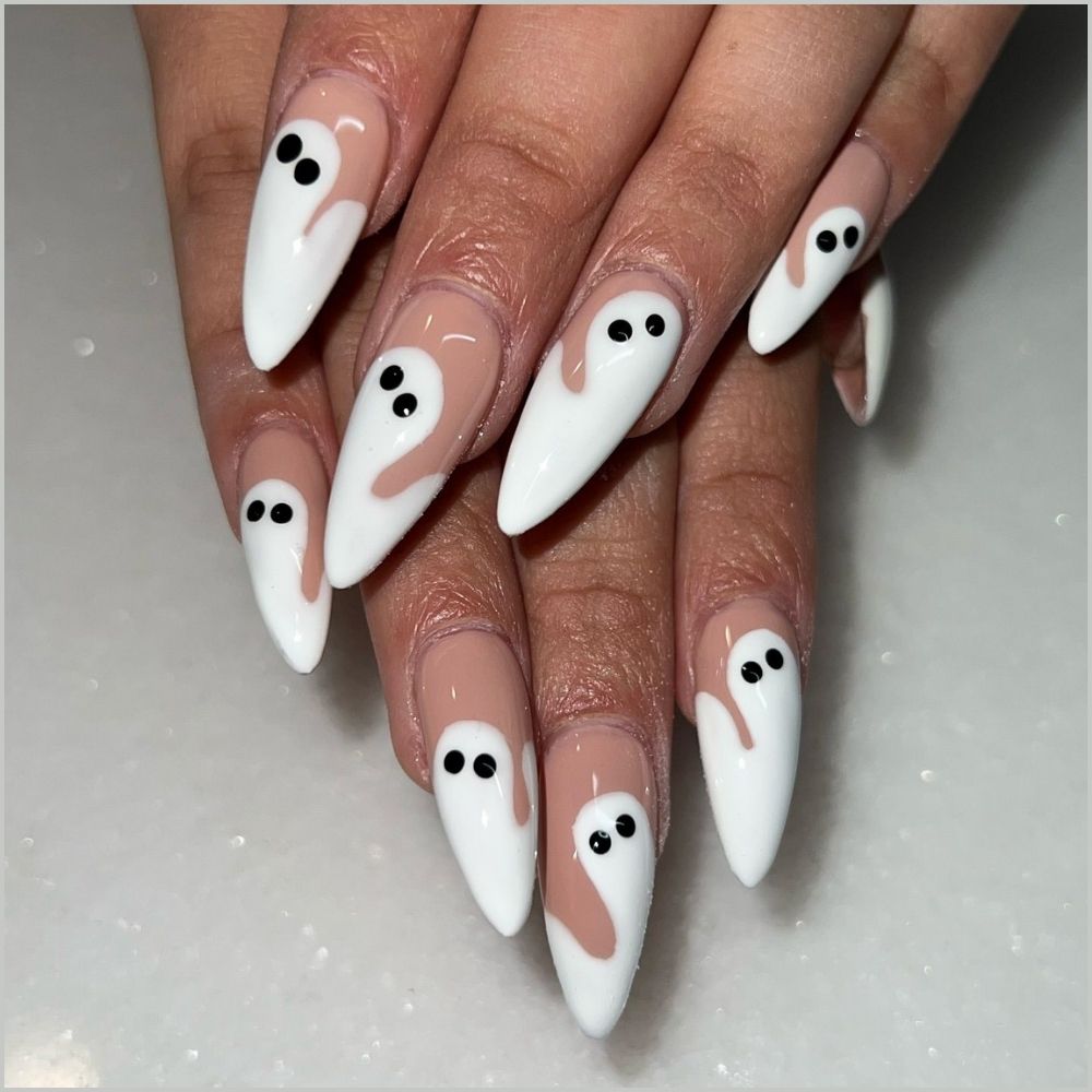 Close up of nails with spooky nails having Easy Ghost Nail Art