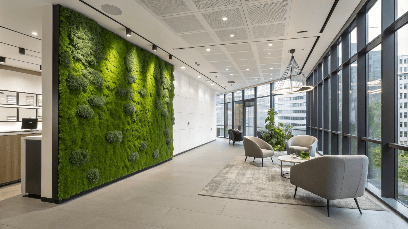 A modern office space featuring a preserved moss wall installation