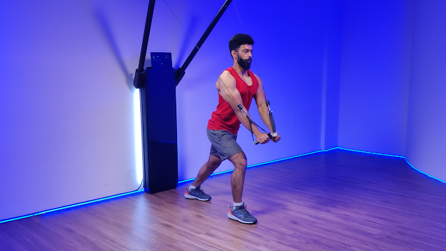 man working out on an all-in-one fitness machine, demonstrating its versatility for strength training and full-body exercises.