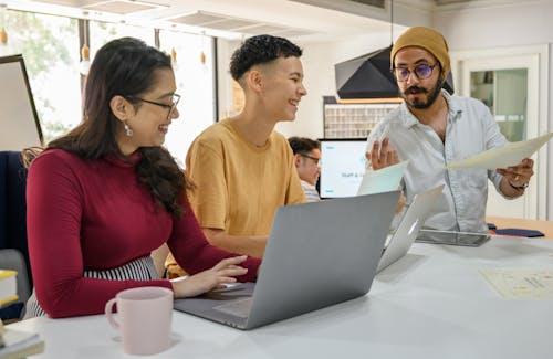 Free People Having a Conversation At Work Stock Photo