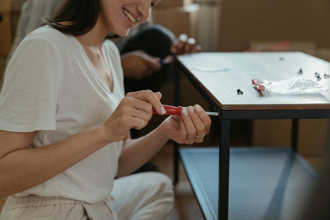A person holding a screwdriver  AI-generated content may be incorrect.