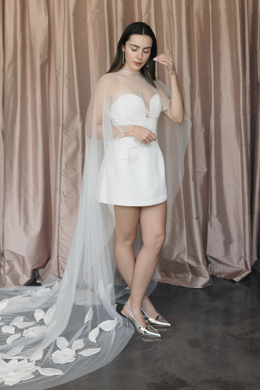 Modern Elopement and Civil Ceremony Bridal Looks: Woman in bridal mini and matching cape.