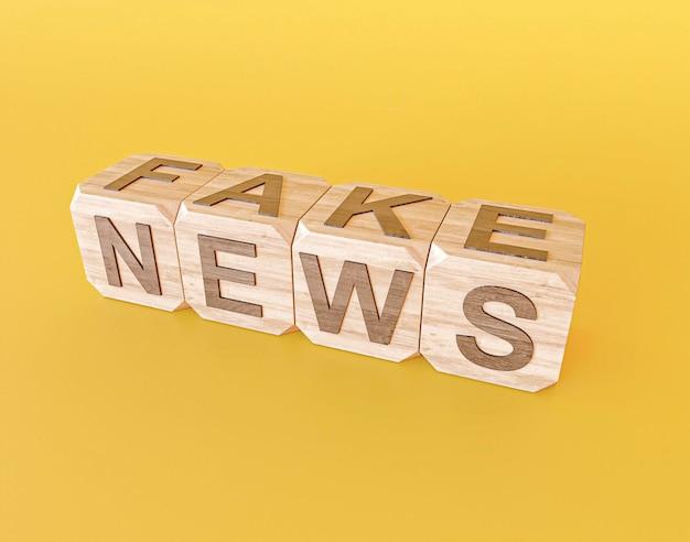 High angle of wooden cubes with fake news