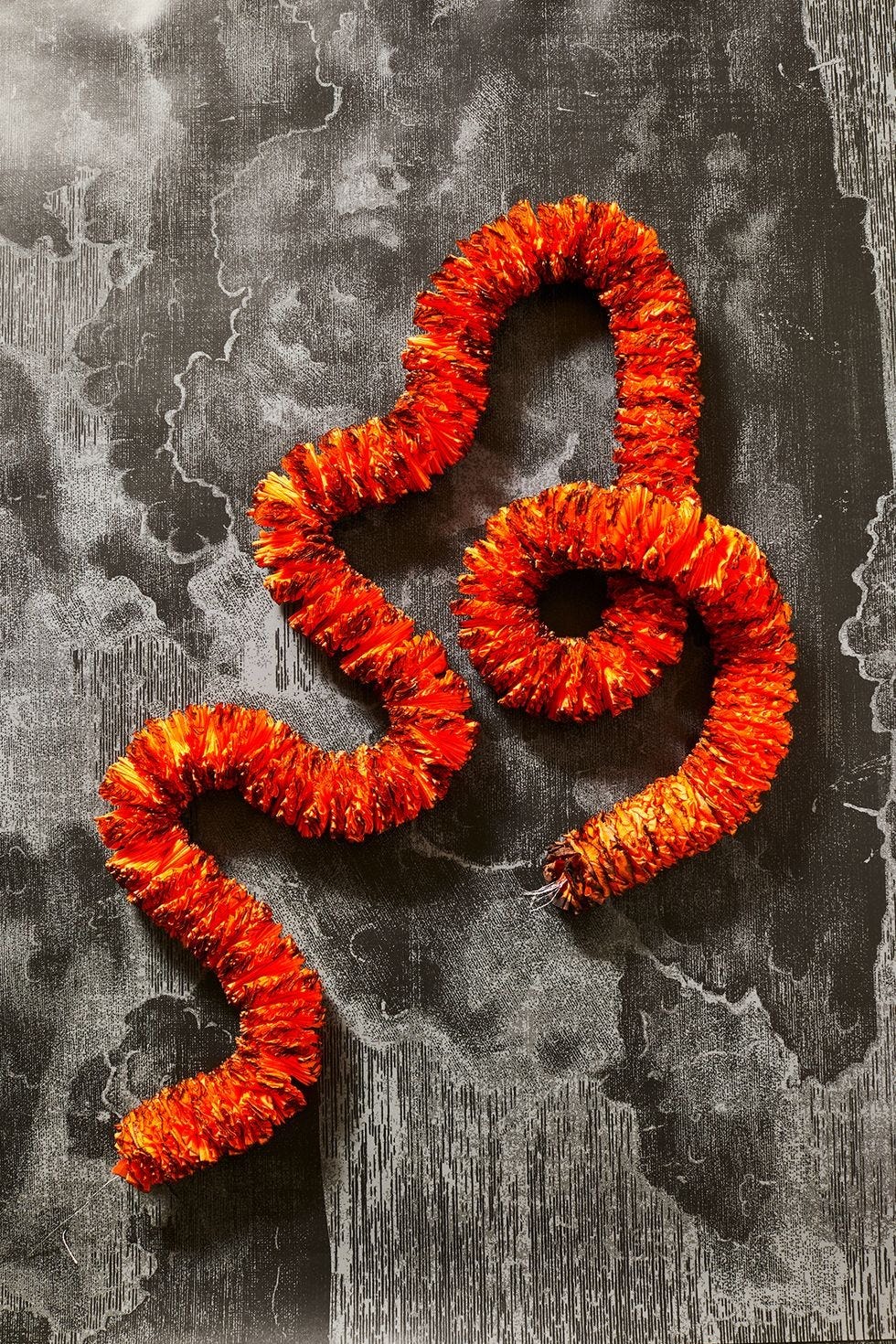 diy halloween decorations, orange crepe paper garland