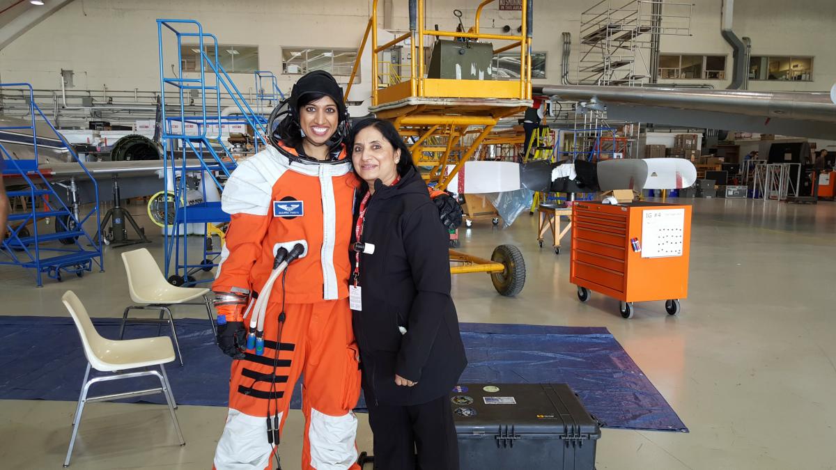 Dr. Shawna Pandya in the Final Frontier Design IVA (intravehicular activity) spacesuit with her mother, Indira Pandya, during the Project PoSSUM 2016 Parabolic Flight campaign