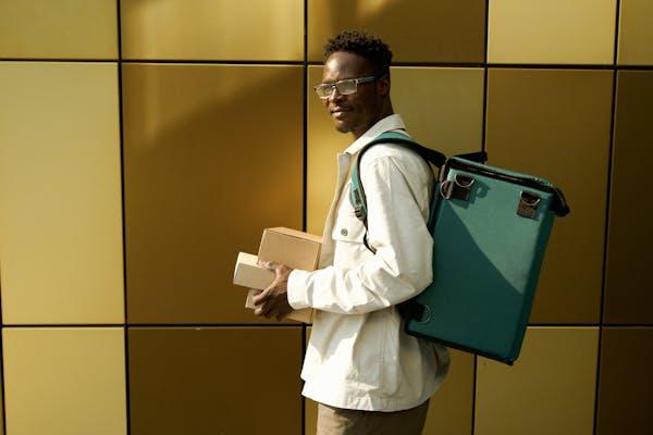 A man delivering eco-friendly food packages.