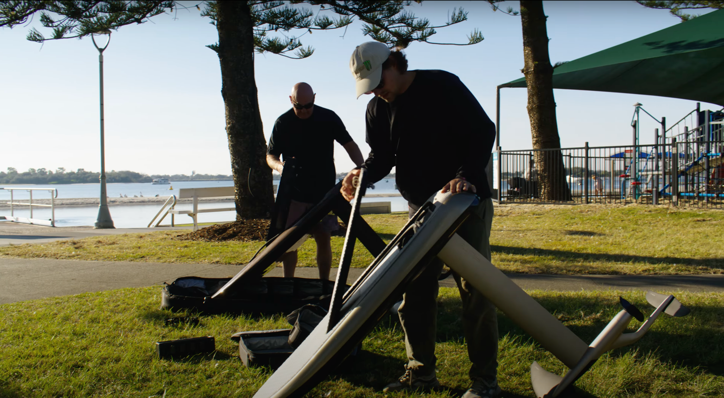 A group of men working on a boat

Description automatically generated