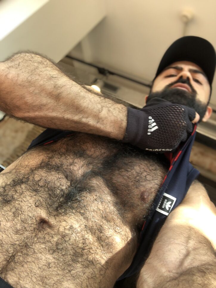 saleh helalat pulling up his tank top showing off his extremely hairy chest and abs for gay xxx porn content