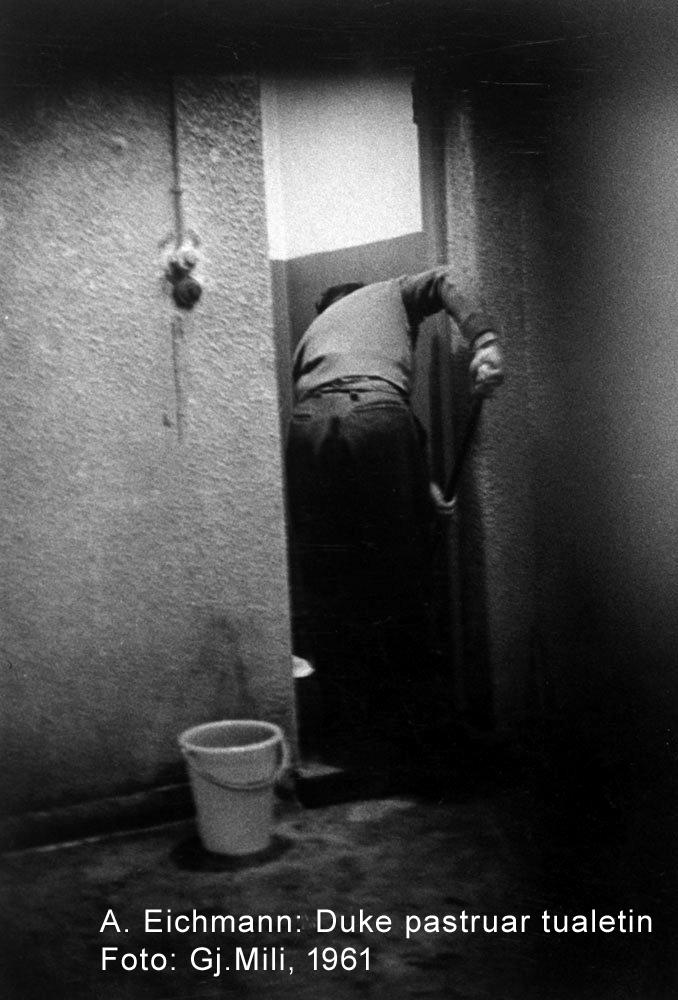 Doing chores, Eichmann mops bathroom floor in jail near Haifa where he has been held+.jpg