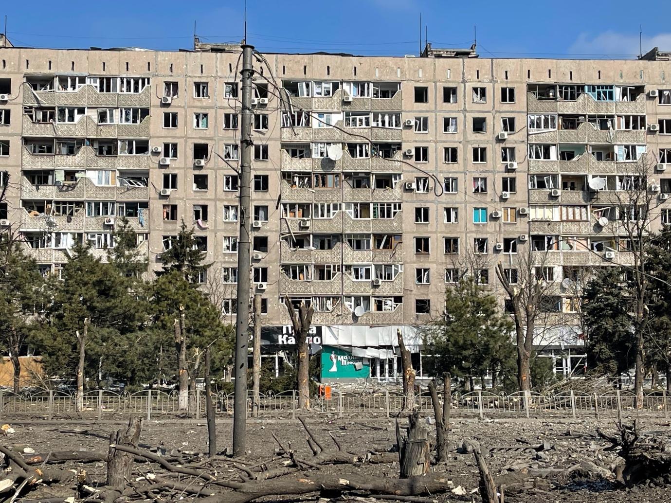 A building with trees in the background

Description automatically generated