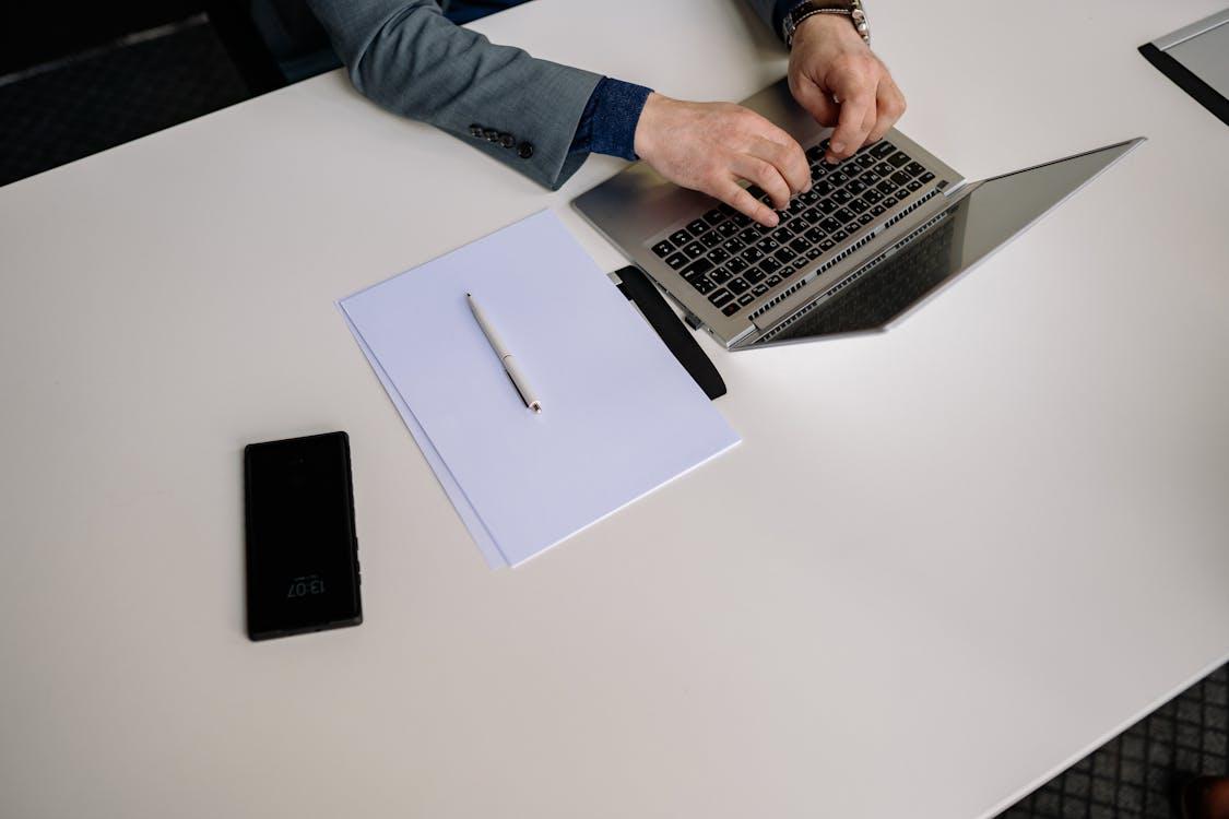 Free Hands Typing on Laptop Stock Photo