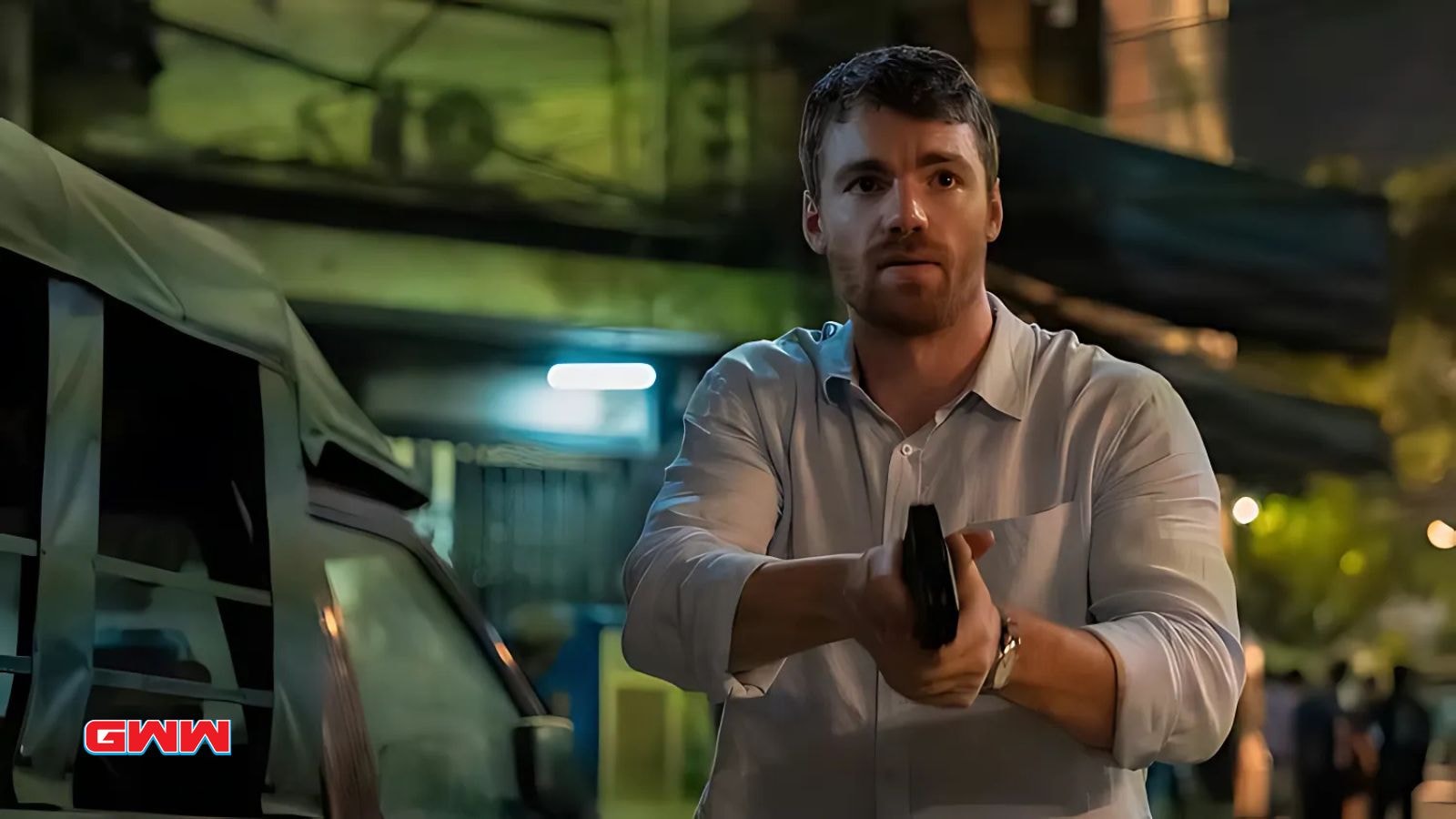 Gabriel Basso as Peter Sutherland with a gun in his hand in The Night Agent Season 2