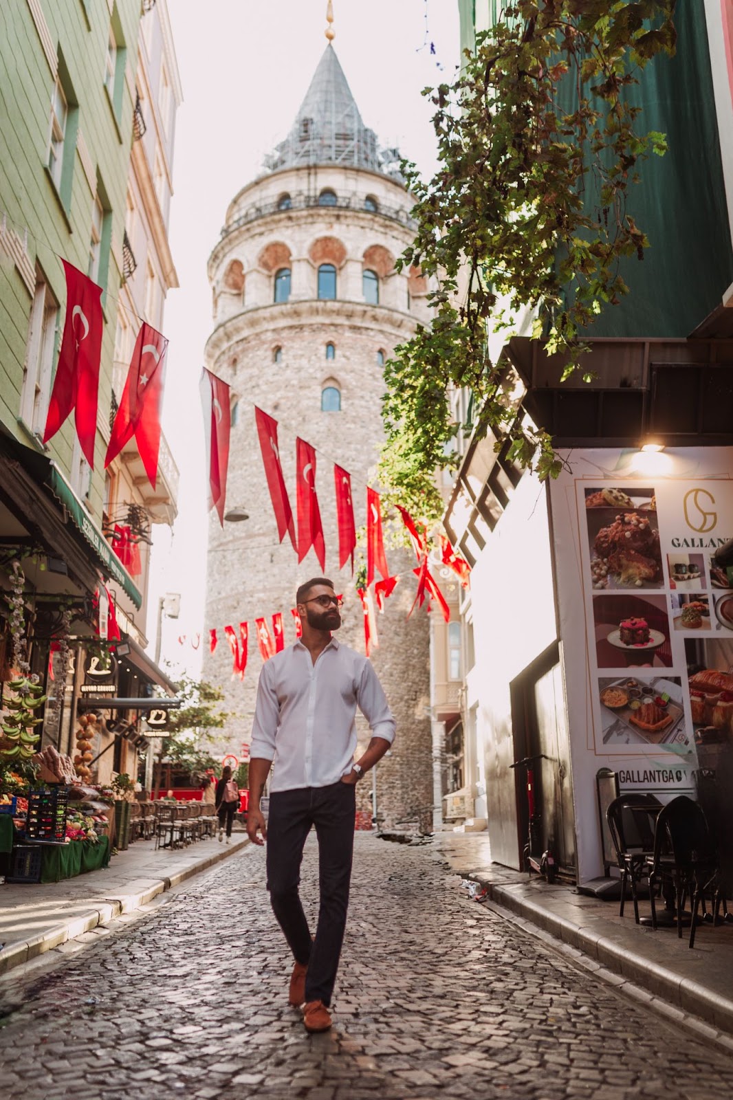 Strolling through Galata — flags above, history behind.