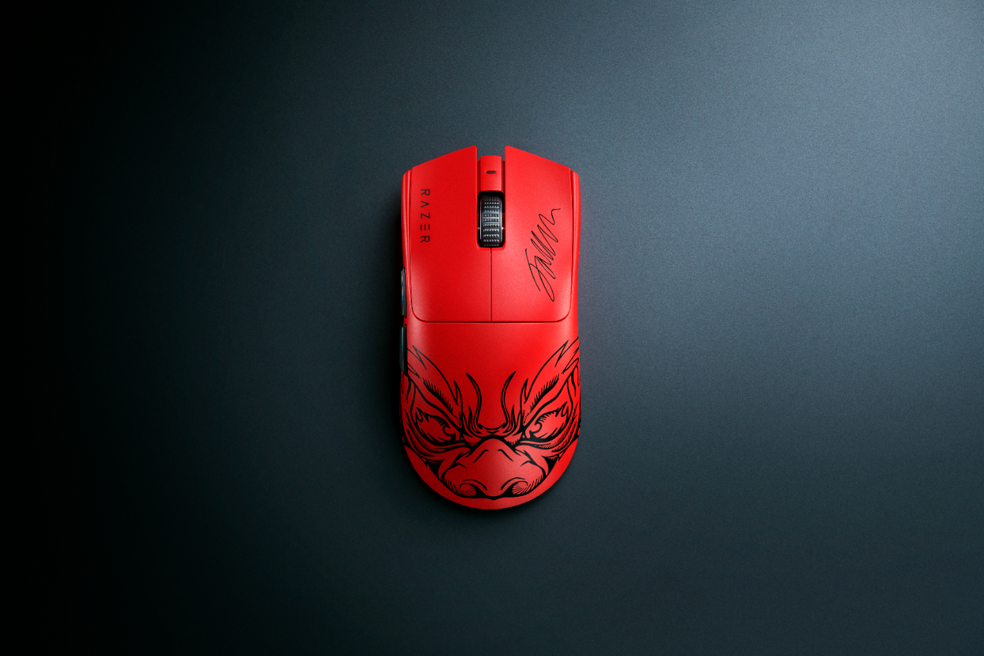 A red computer mouse with a drawing of a face

Description automatically generated