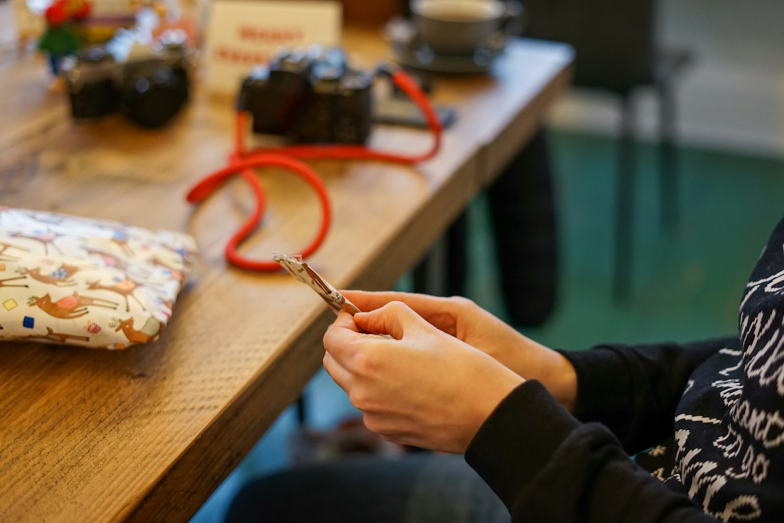 A woman wrapping a Christmas gift 