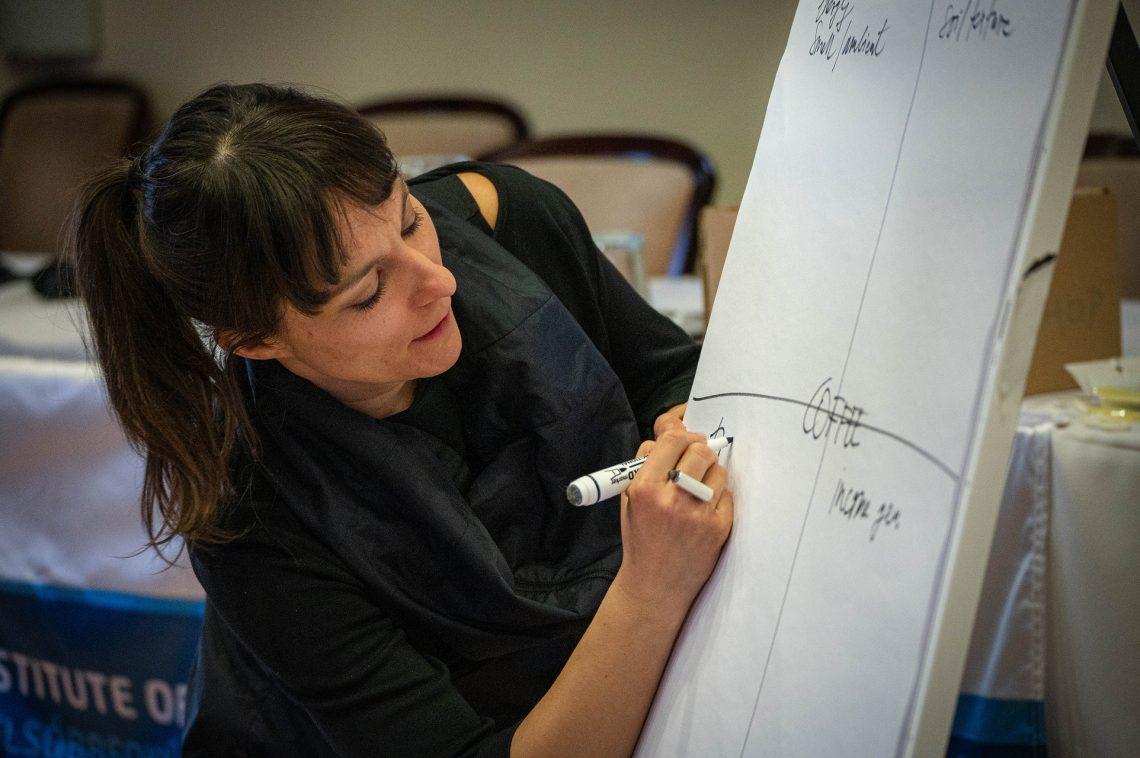A person writing on a whiteboard

AI-generated content may be incorrect.