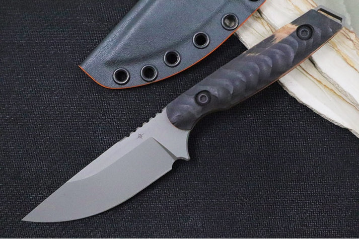 An image showing the Toor Knives Field 3.0. It's a fixed blade knife featuring a drop point CPM-3V steel blade and a black G-10 handle.