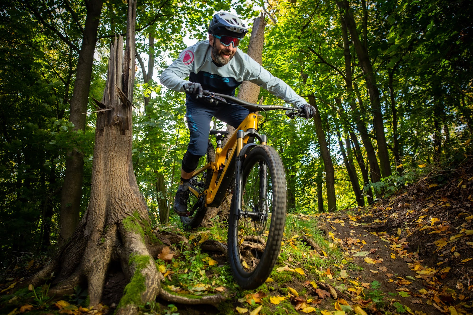 This image shows the man riding an Trek Fuel EX 8 Gen 6 406 Mountain Bike.